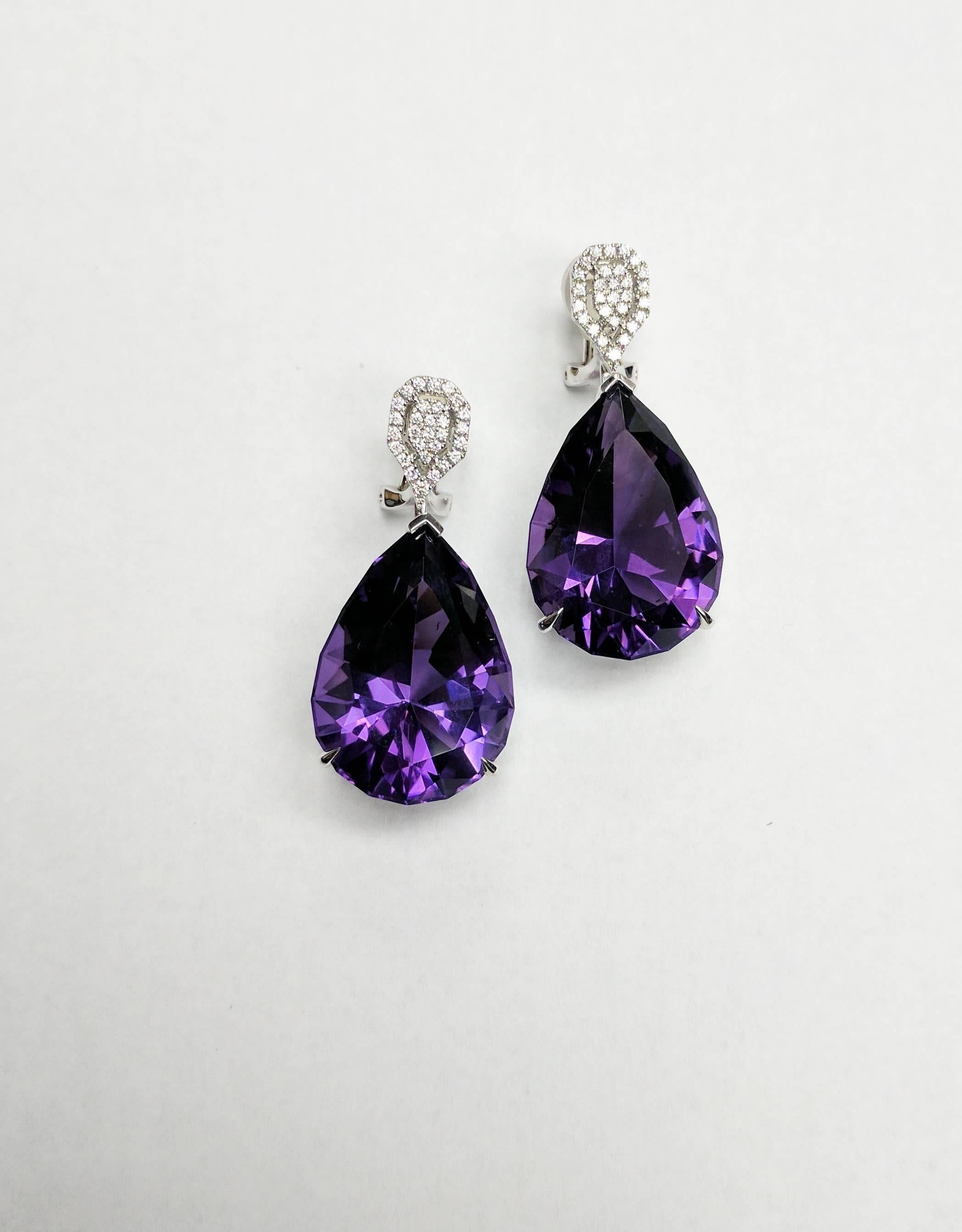 One-of-a-kind Frederic Sage pear-shaped Amethyst earrings with omega microset diamond cluster clip top

Total Amethyst weight: 50.94 ct
Total diamond count: 58
Total diamond weight: 0.35 ct