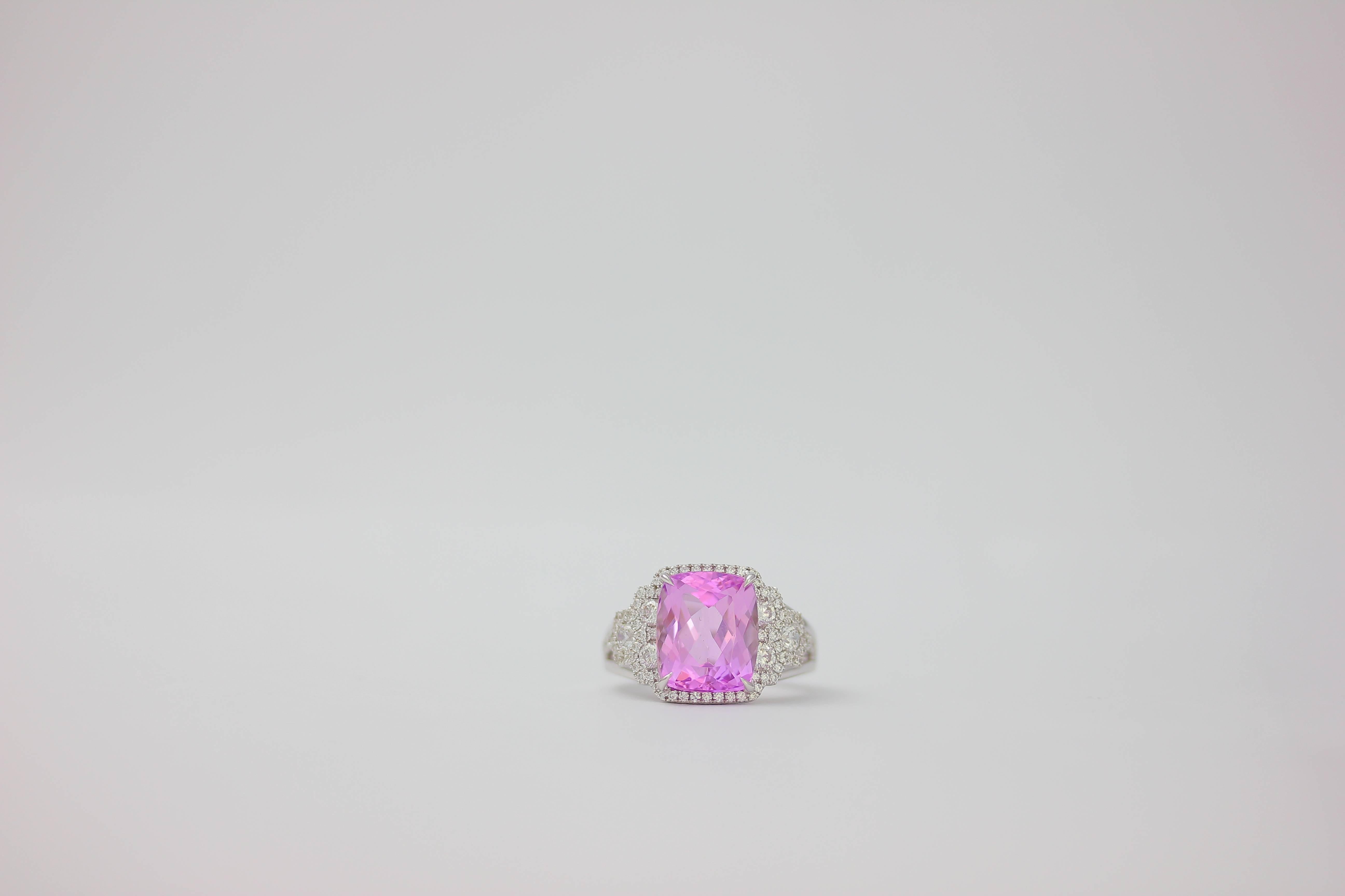 One of Kind Kunzite Diamond Ring set in 18k White gold with beautiful white diamonds. 
Kunizite: 6.43 Carats
Diamond Count 80
Diamond Weight: 0.85 Carat
