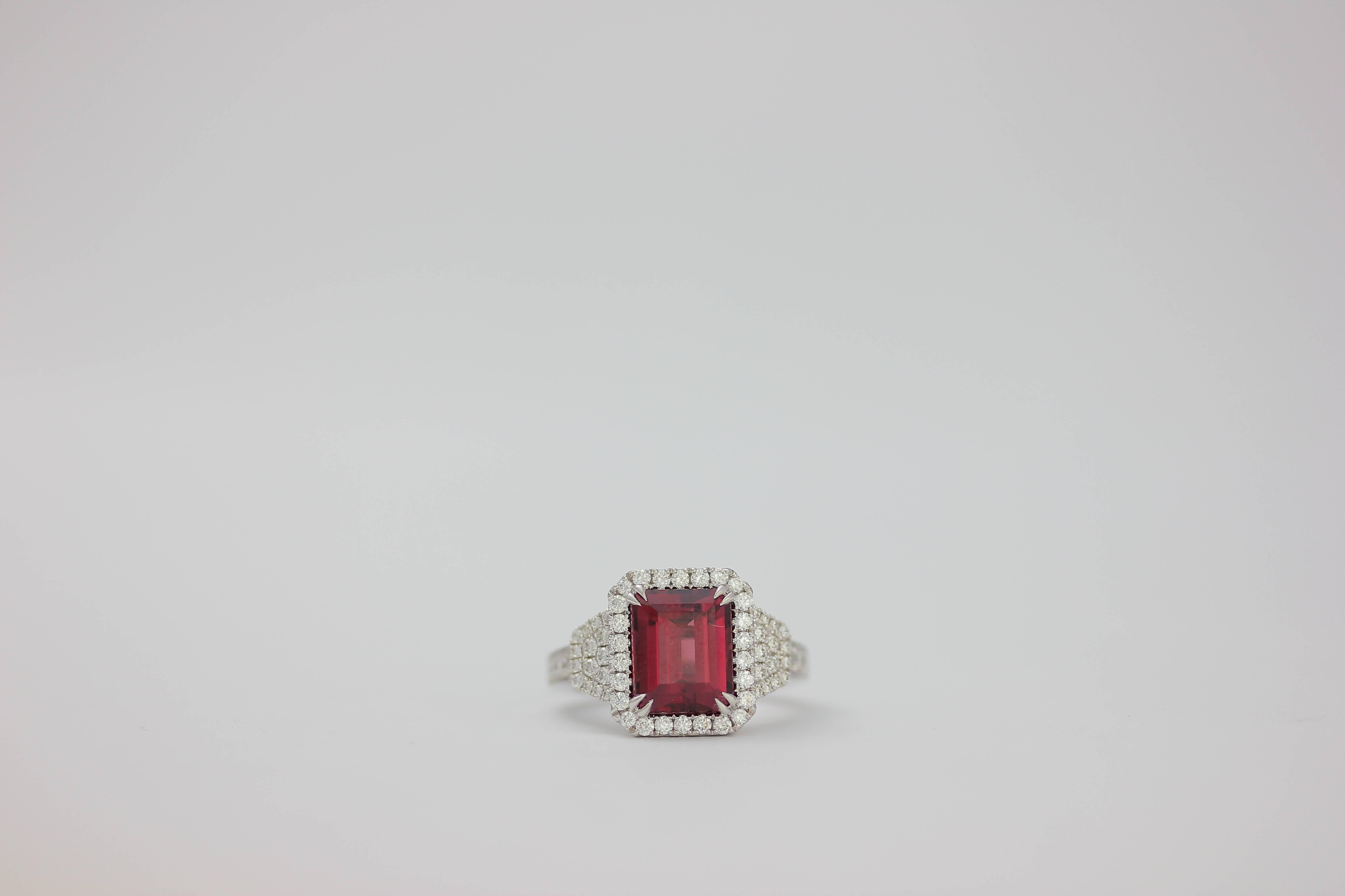 One of Kind Fine Fine Rhodolite Garnet Ring set in 18K White Gold, adorned with white diamonds. 
Rhodolite Garnet 4.83 Carats
Diamond Count 64
Diamond weight: 0.74 Carat