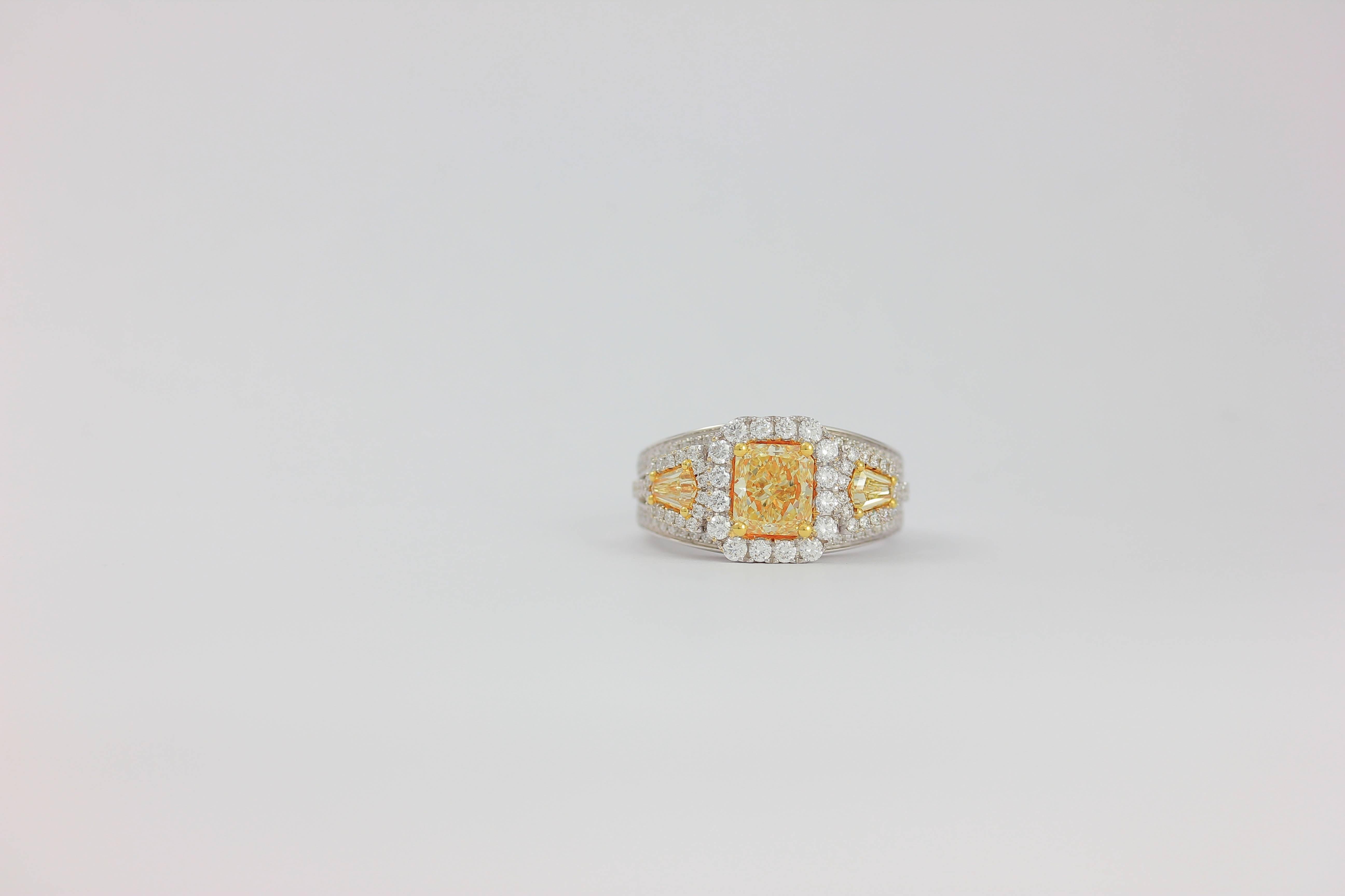 18K WG 3-STONE YELLOW DIAMOND ONE OF KIND RING 

Radiant Center 1.30 CARAT
Side Yellow Diamonds  0.48 CARAT
Diamond Count 114
White Diamond Weight  0.88 CARAT