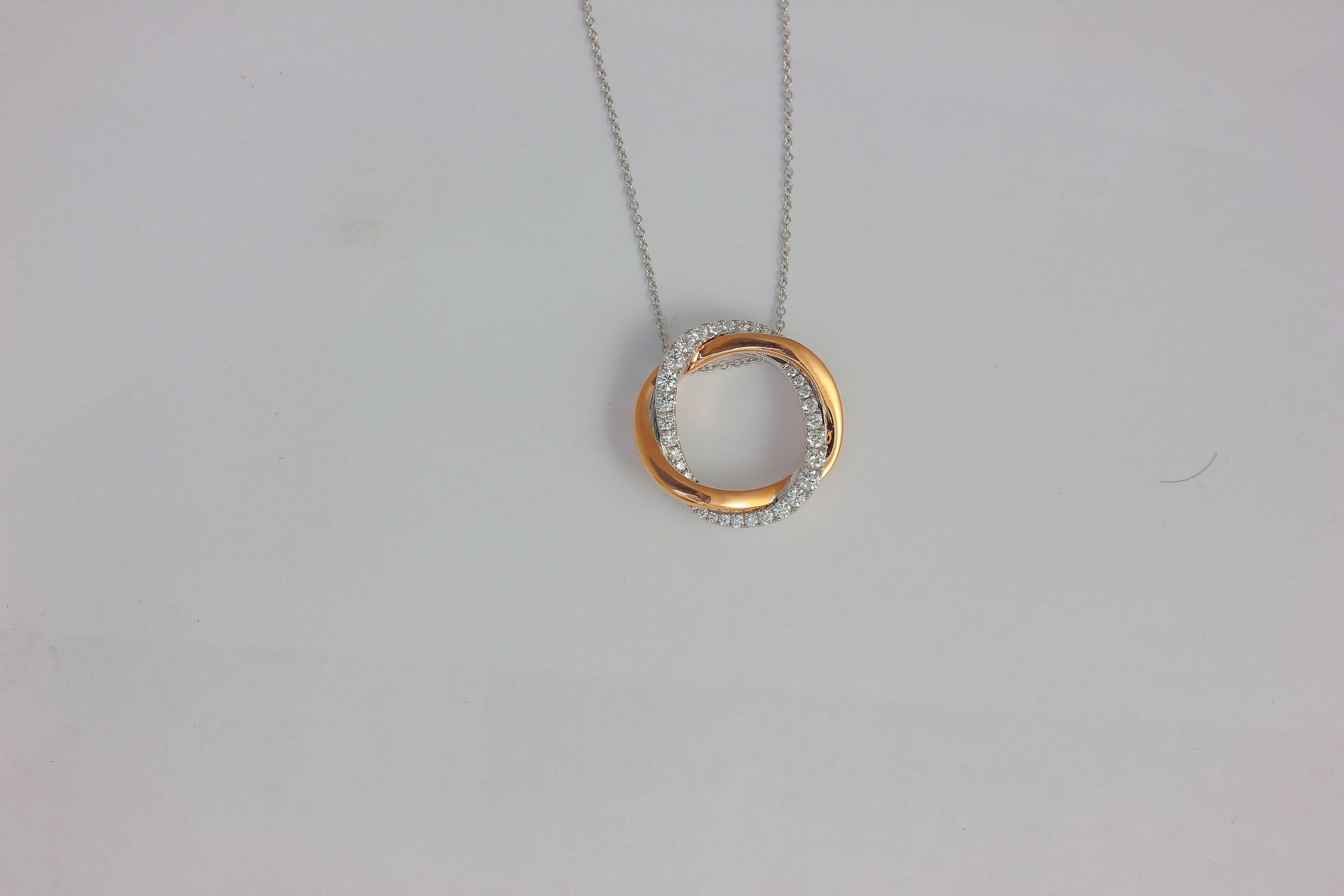 14K PWG LARGE TWIST HALO DIAMOND IN WG AND POLISHED PG PENDANT WITH CHAIN
32 Diamonds  0.54 Carats