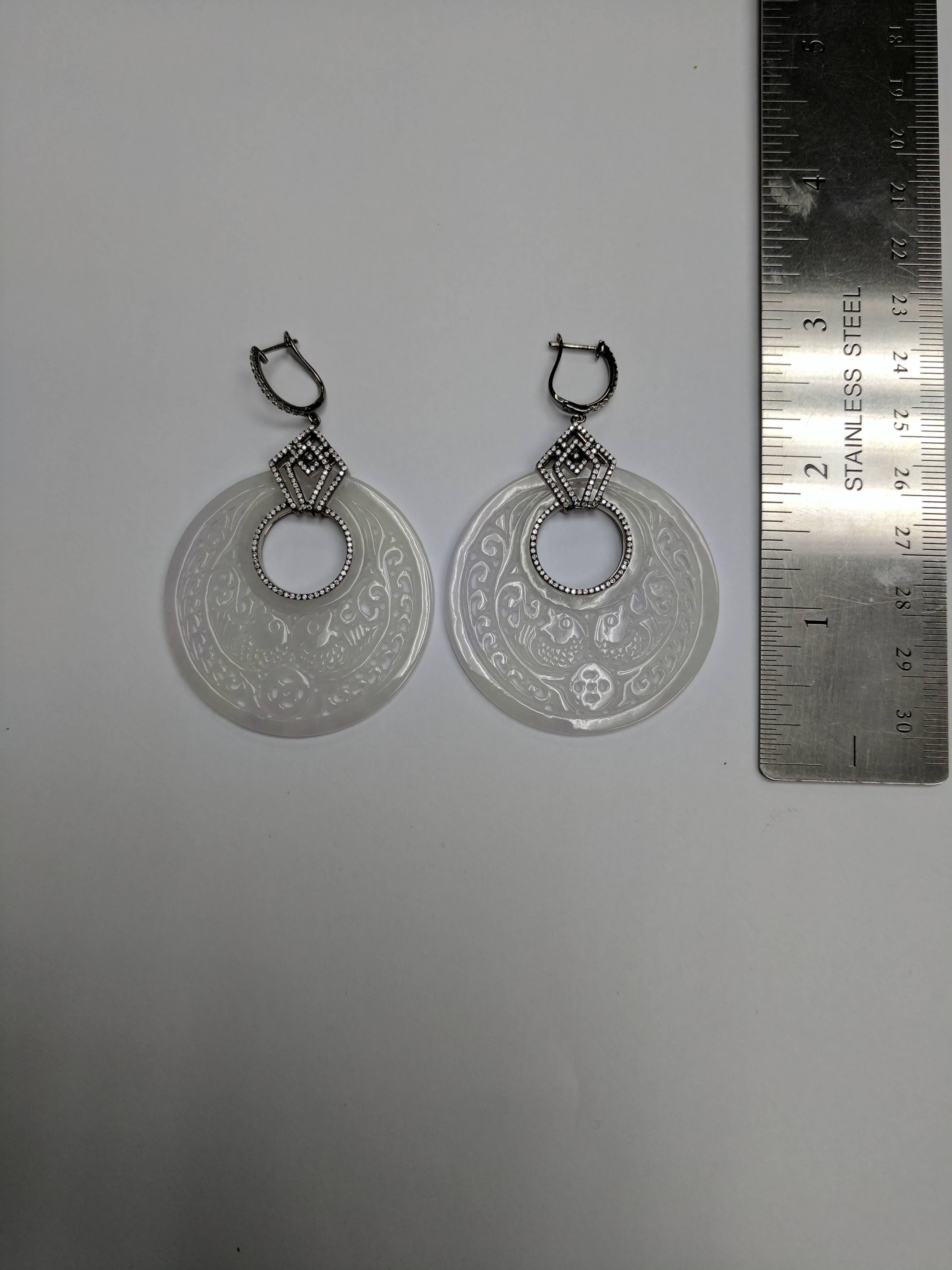 18K WG LARGE OPEN ROUND KOI CARVED WHITE JADE WITH DIAMOND ON TOP AND ON BALE EARRINGS
2 WJD 70.12 Carats, 254 DIA 0.95 Carats