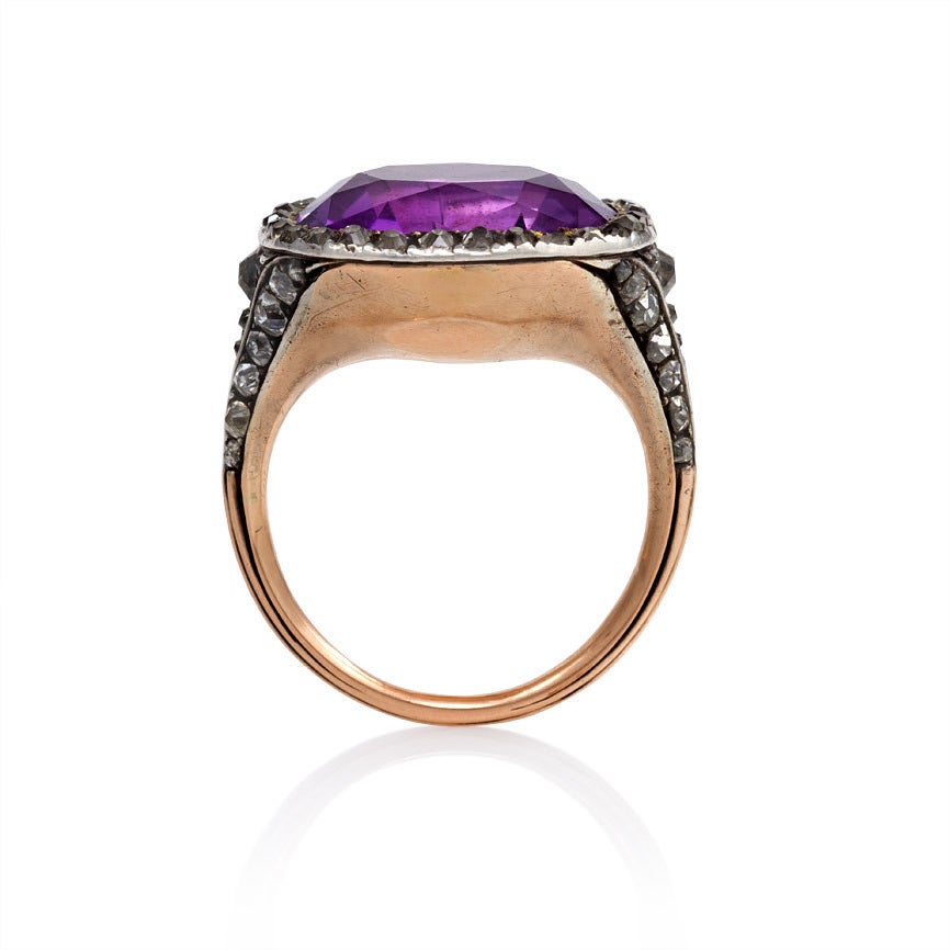 An antique gold and cushion-cut amethyst ring with a diamond surround and mounting, in 15k and sterling silver. Inscribed: Anna Napier, Ob. Dec. 4 1775, Age 102.