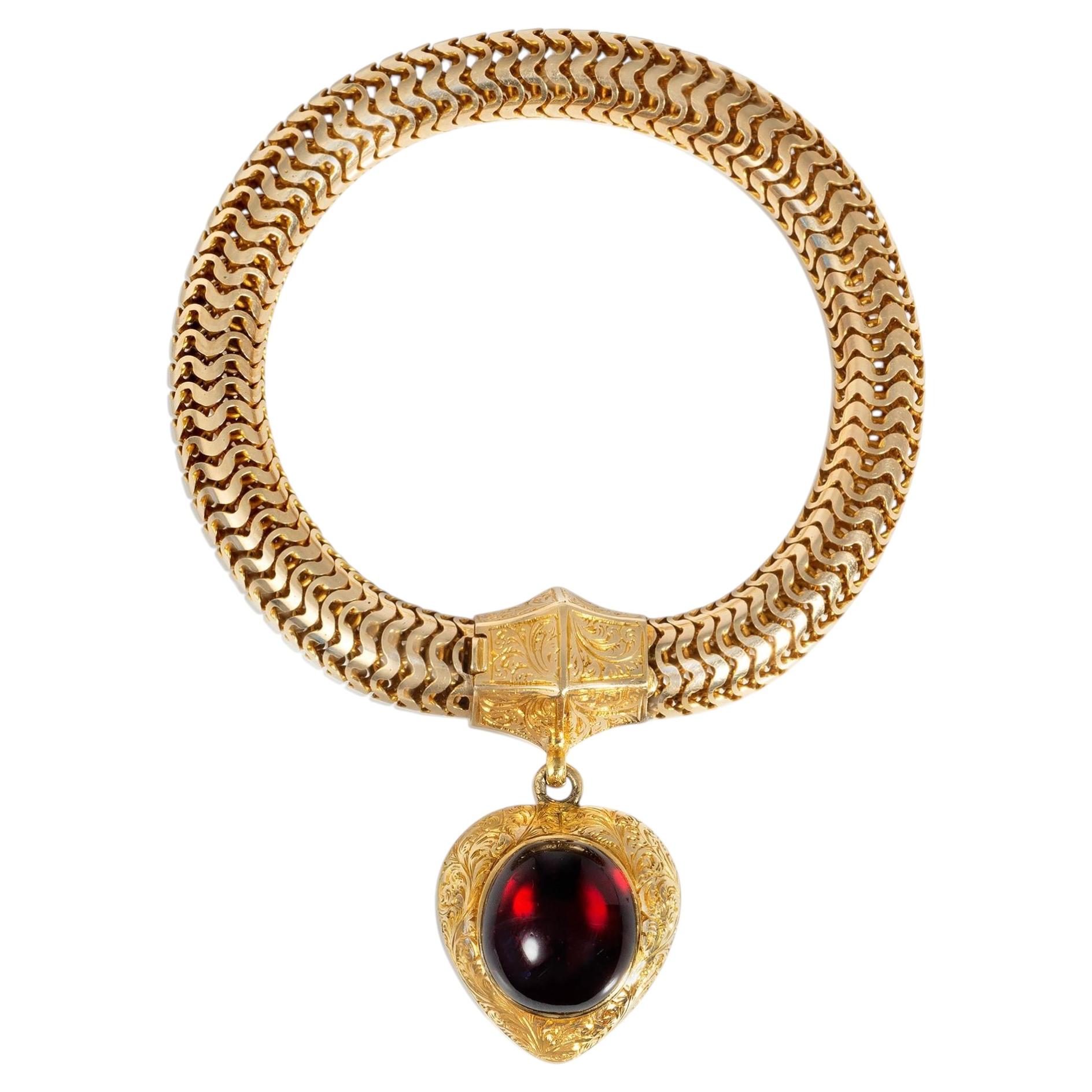 Antique snake chain bracelet with garnet heart charm For Sale