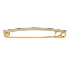 Lacloche, Paris Edwardian diamond, ruby, and gold safety pin brooch