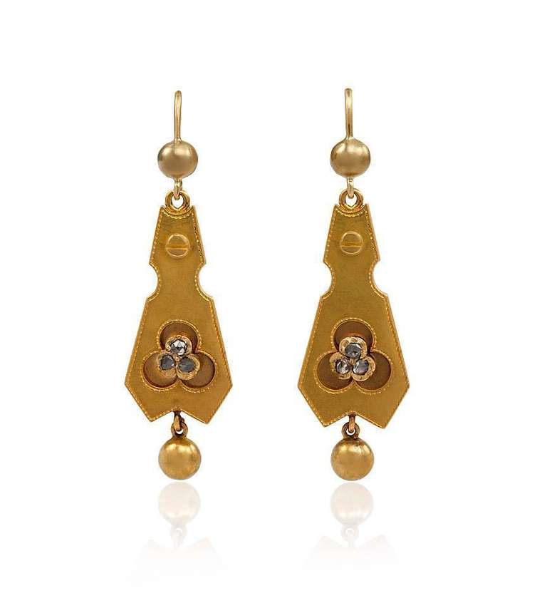A pair of antique gold pendant earrings of tapering geometric design, set with a rose-cut diamond trefoil, in 18k.