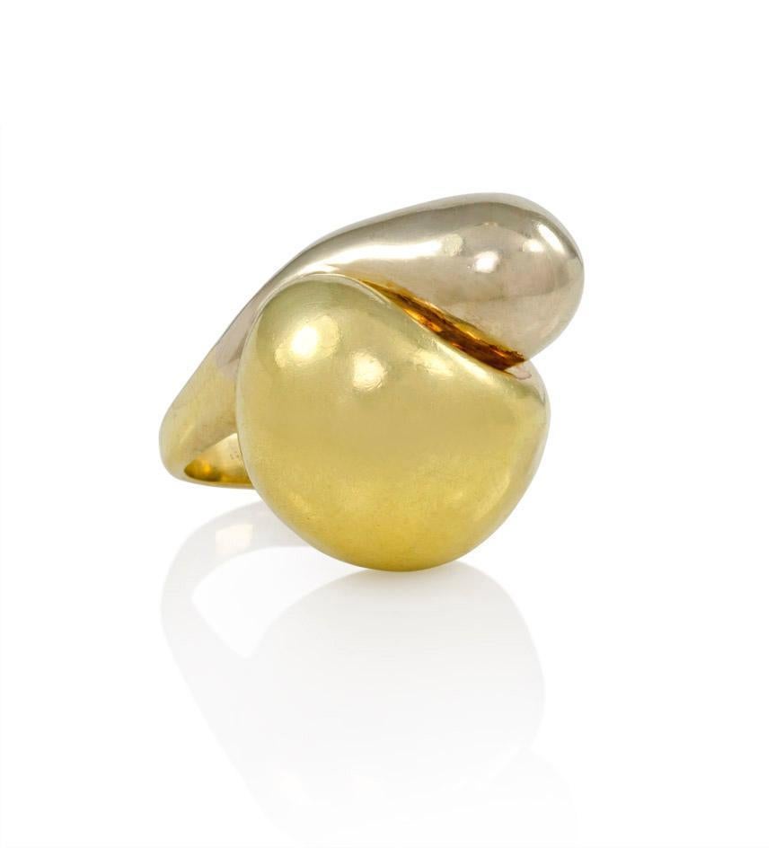 A two-color gold bypass ring of sculptural abstract design, in 18k.
Current size: 5 1/2 (re-sizing is possible)

Dimensions: 25 mm top to bottom