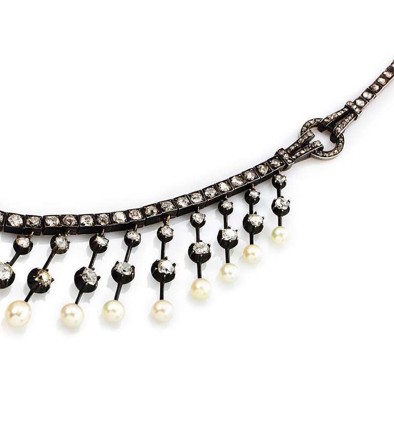 Antique diamond and natural pearl fringe design necklace with graduating knife wire pendants, each set with two diamonds and a natural pearl, in silver and 18k gold.  France.  Atw 9.55 cts.