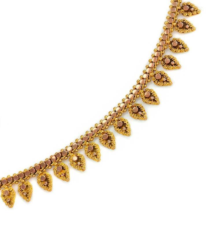 An antique two-color gold fringe necklace with palmette shaped pendants, in 18k. France.