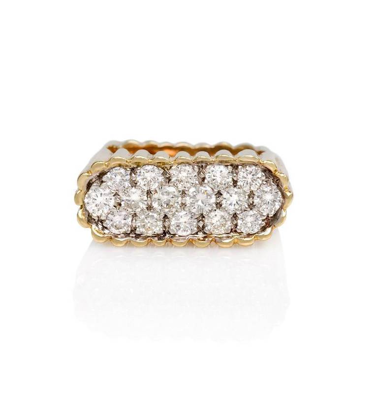 A gold, square-form ring of ribbed design with a lozenge-shaped pavé diamond inset; set with approx. 1.50 ct. tw of diamonds, in 18k.