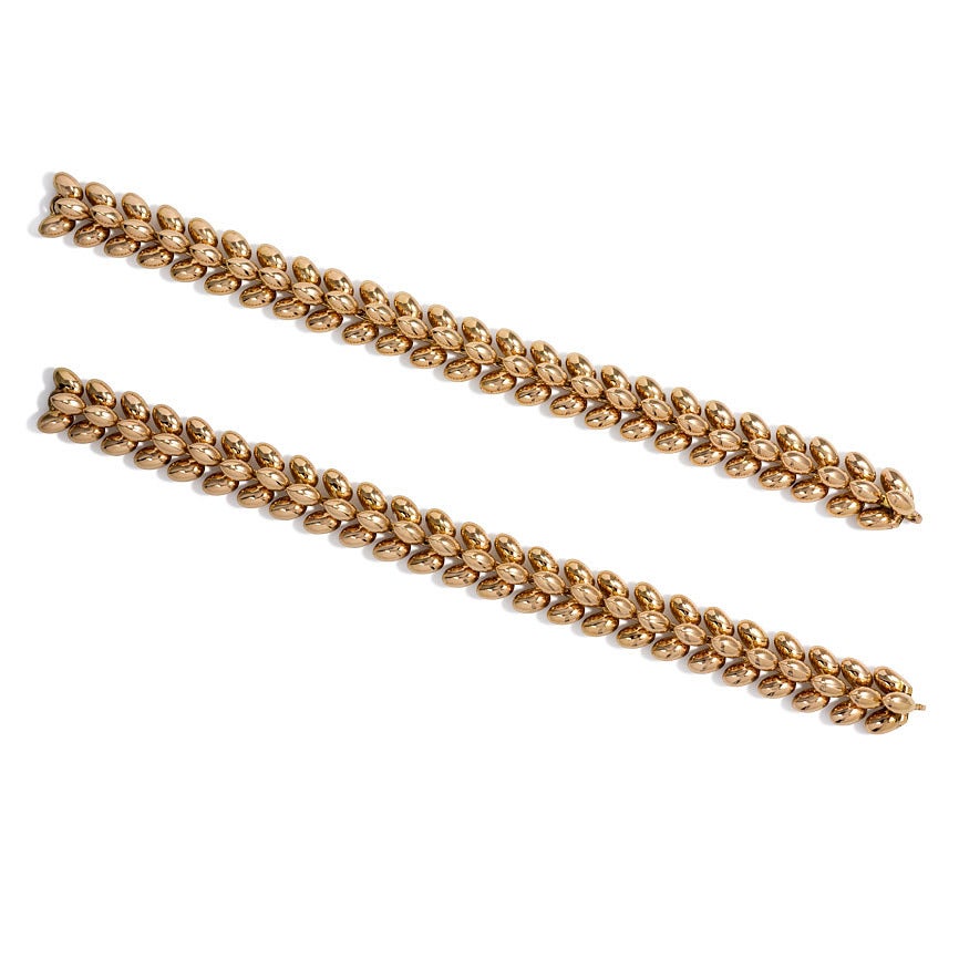 A rose gold necklace convertible to two bracelets of dimensional wheat-like design in 18k. Boucheron, France. #58307.  (Measurements are for each bracelet.)
