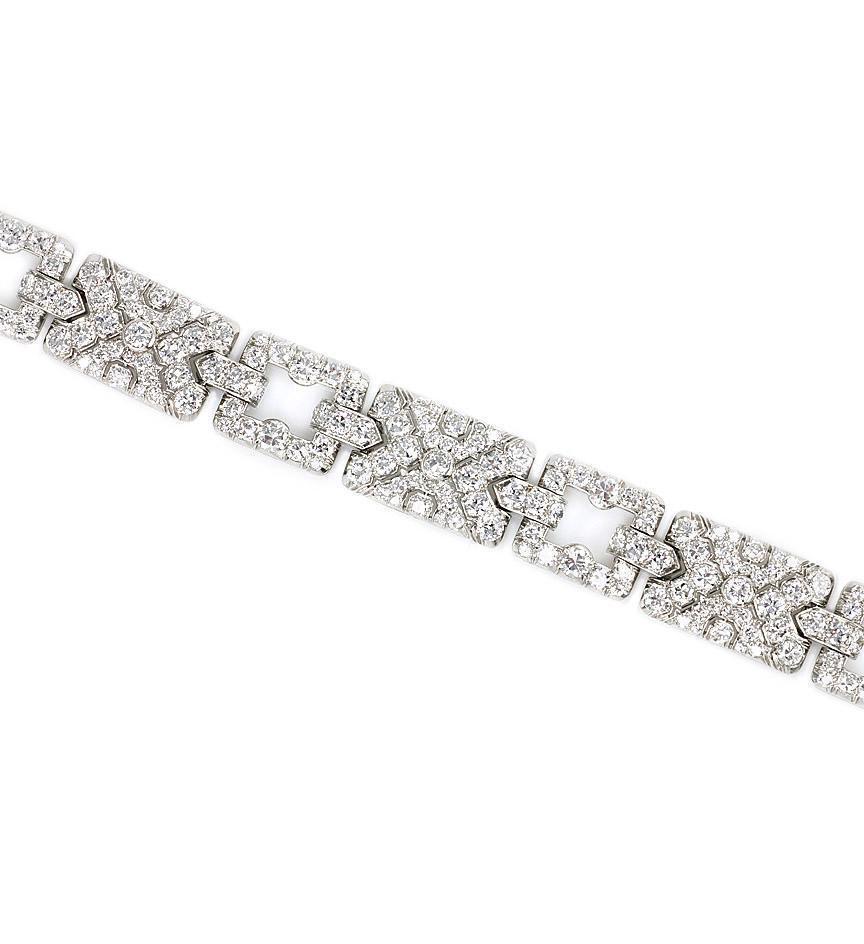 An Art Deco diamond bracelet with alternating open and pavé diamond rectangular links, in platinum.  Atw 12.90 cts.