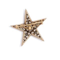 Broche étoile ancienne en argent et or avec diamants