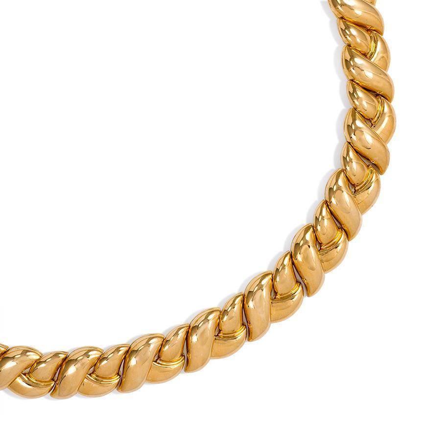 A gold semi-rigid necklace of braided design, in 18k. Van Cleef & Arpels.  France #84653R4.