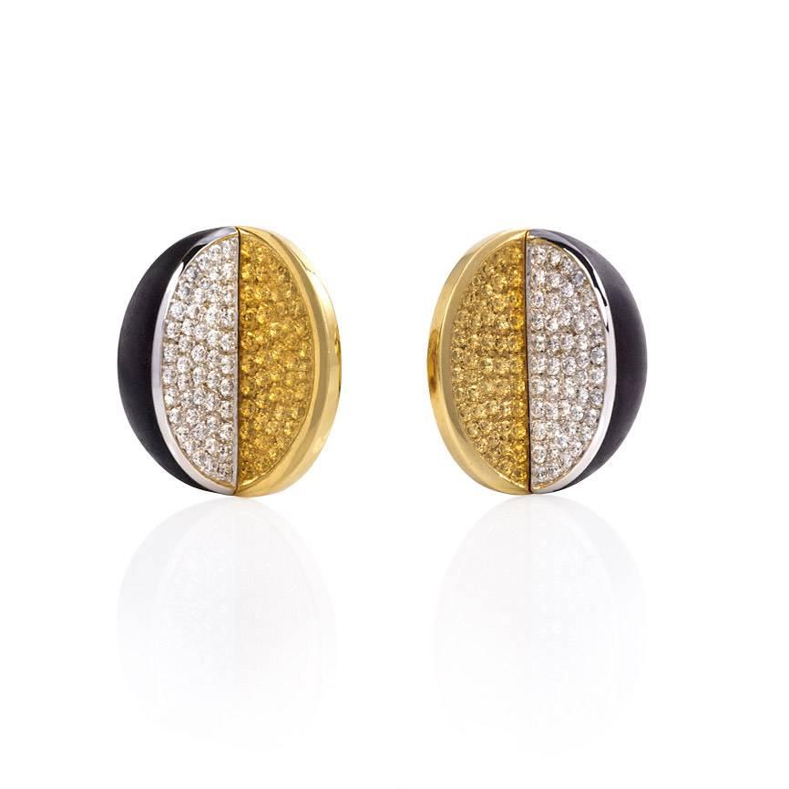 A pair of geometric gold earrings comprised of a half dome of ebony and a pavé diamond semi-circular panel, in 18k.  Approx. 1.96 ct. tw. diamonds.