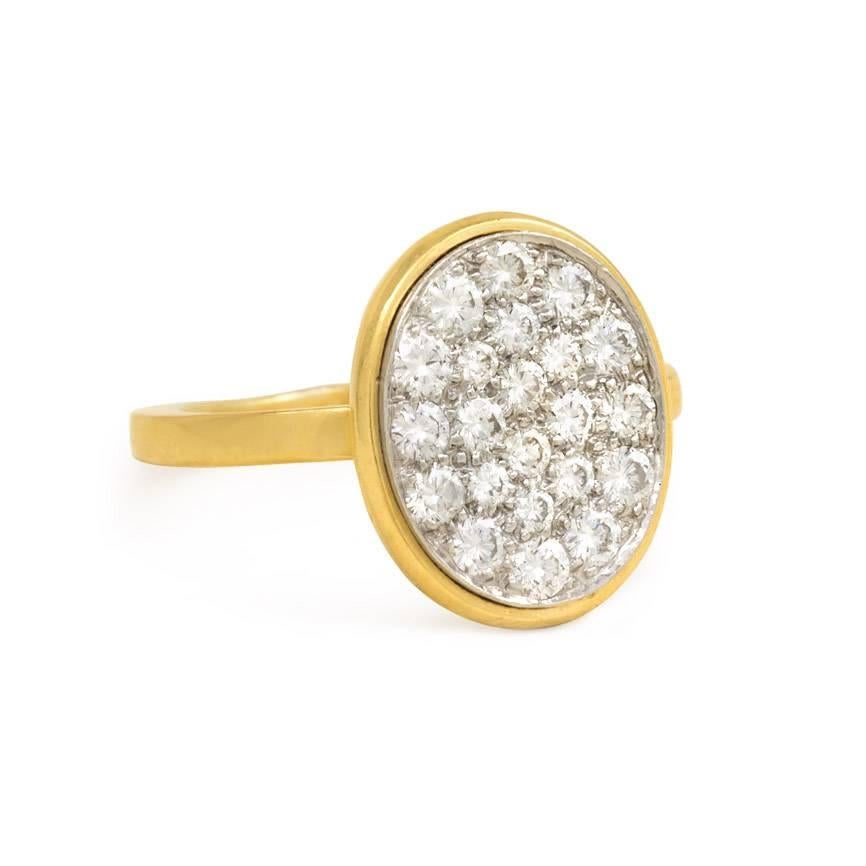 An oval pavé diamond ring, in 18K gold and platinum. Dinh Van for Cartier, #38831.  Current ring size: 6 1/2
Oval top dimensions: 5/6