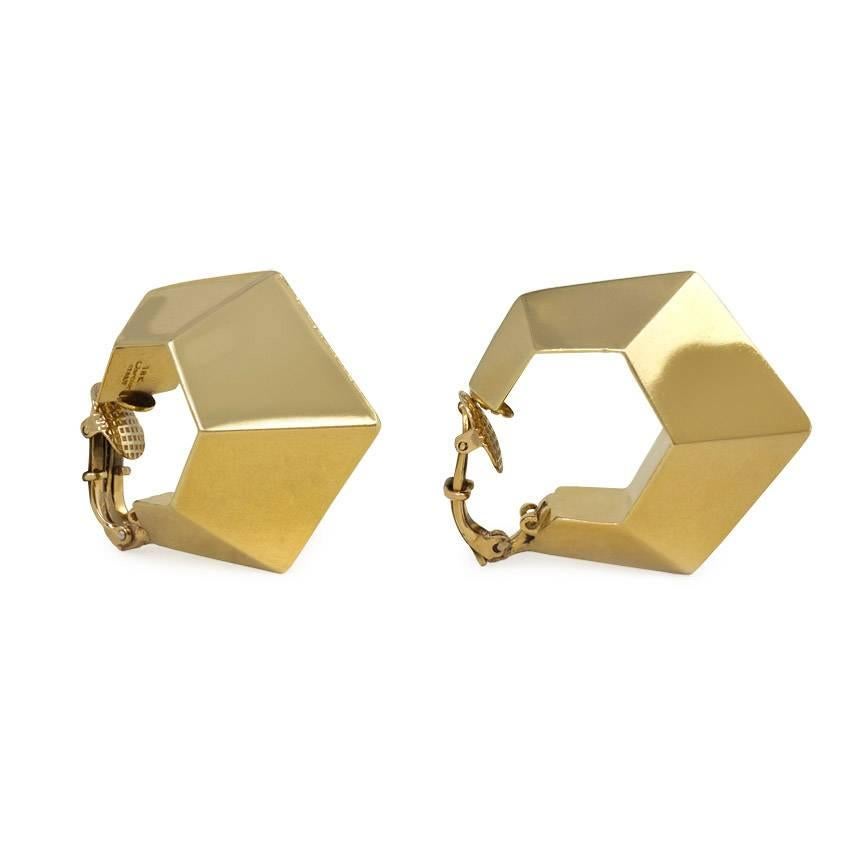 A pair of geometric faceted front-facing hoop earrings, in 18k gold with 14k gold clip backs. Cartier, Italy
