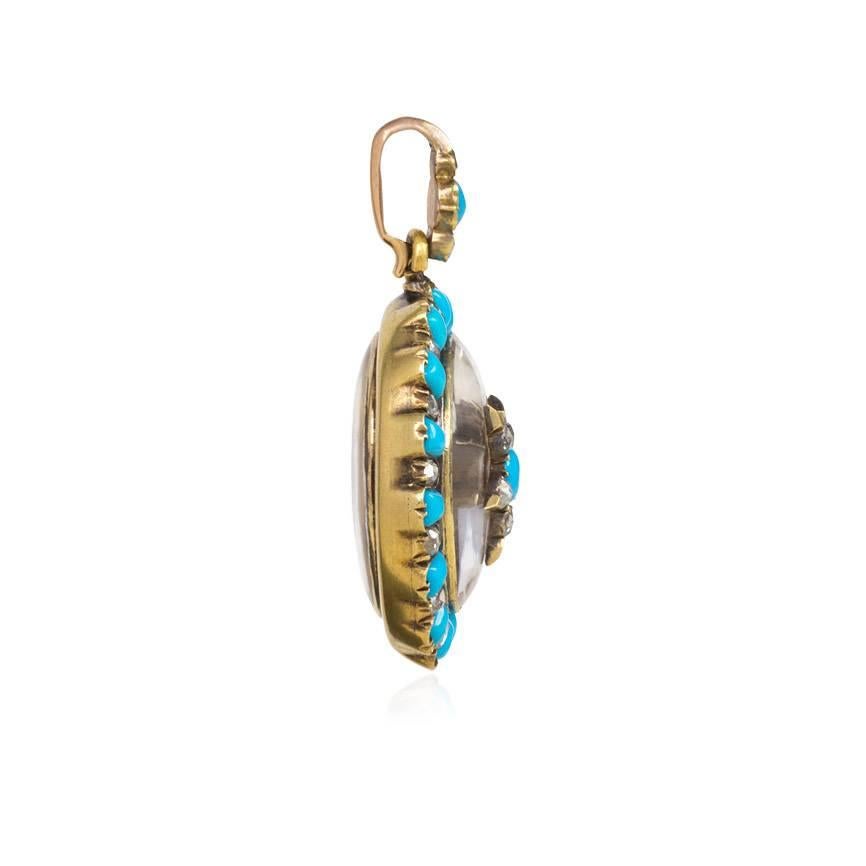 An antique carved crystal locket with a rose diamond and turquoise surround and a central star ornament, in 18k gold. French import

1 3/4