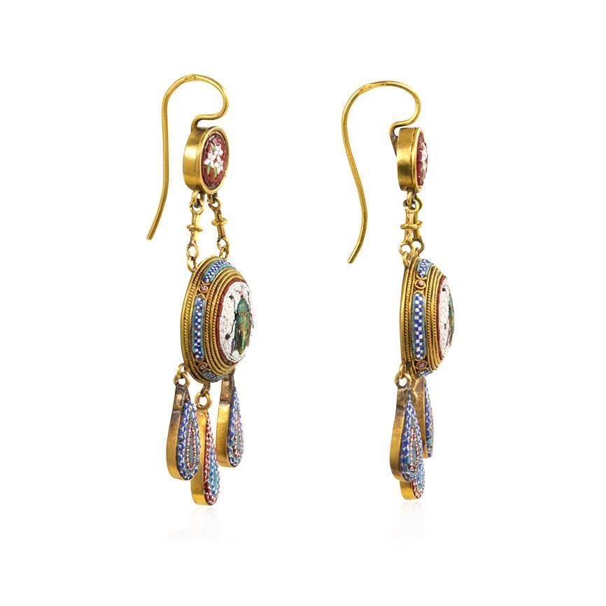 A pair of antique pendant earrings comprised of micromosaic scarab bullas suspending from floral surmounts and terminating in girandole drop pendants, in 18k gold. Vatican marks
