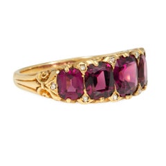 Antique garnet and diamond half-hoop ring