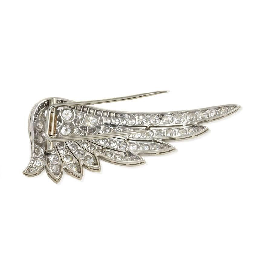 An Art Deco diamond clip brooch in the form of a wing, in platinum. Atw. 5.17 cts. old European cut diamonds.