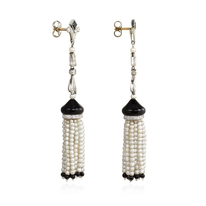 A pair of long Art Deco onyx and diamond earrings with seed pearl and onyx tassels, in platinum.  France