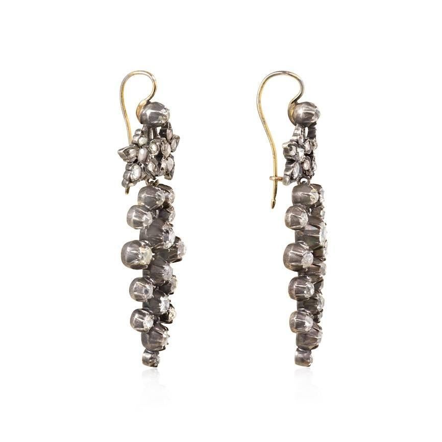 A pair of antique old-mine and rose cut diamond pendant earrings in the form of articulated grape clusters, in sterling silver and 18k gold.  Atw. 3.24 cts.