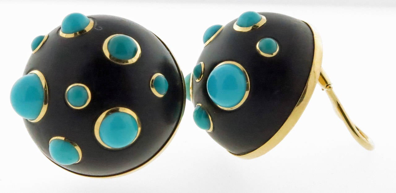 Easy to wear everyday earrings. Each of the handmade 18kt. yellow gold mounts are bezel set with a fruit wood dome with 8 cabochon robin egg turquoise. Each earring measures approx .75