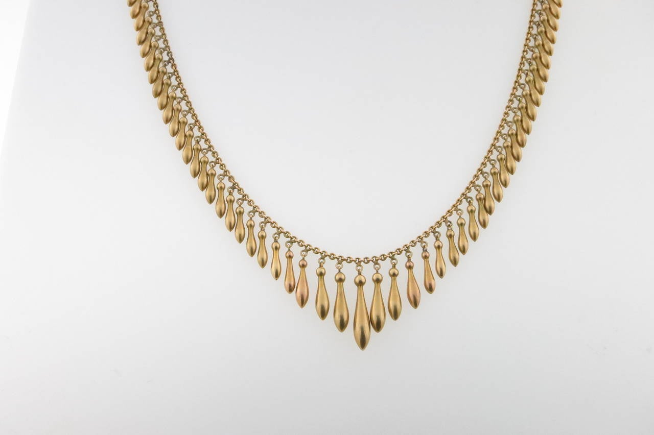 Graceful 14kt. yellow gold Victorian period articulated drippy necklace that drapes beautifully on the throat. The graduated necklace measures 16 1/2