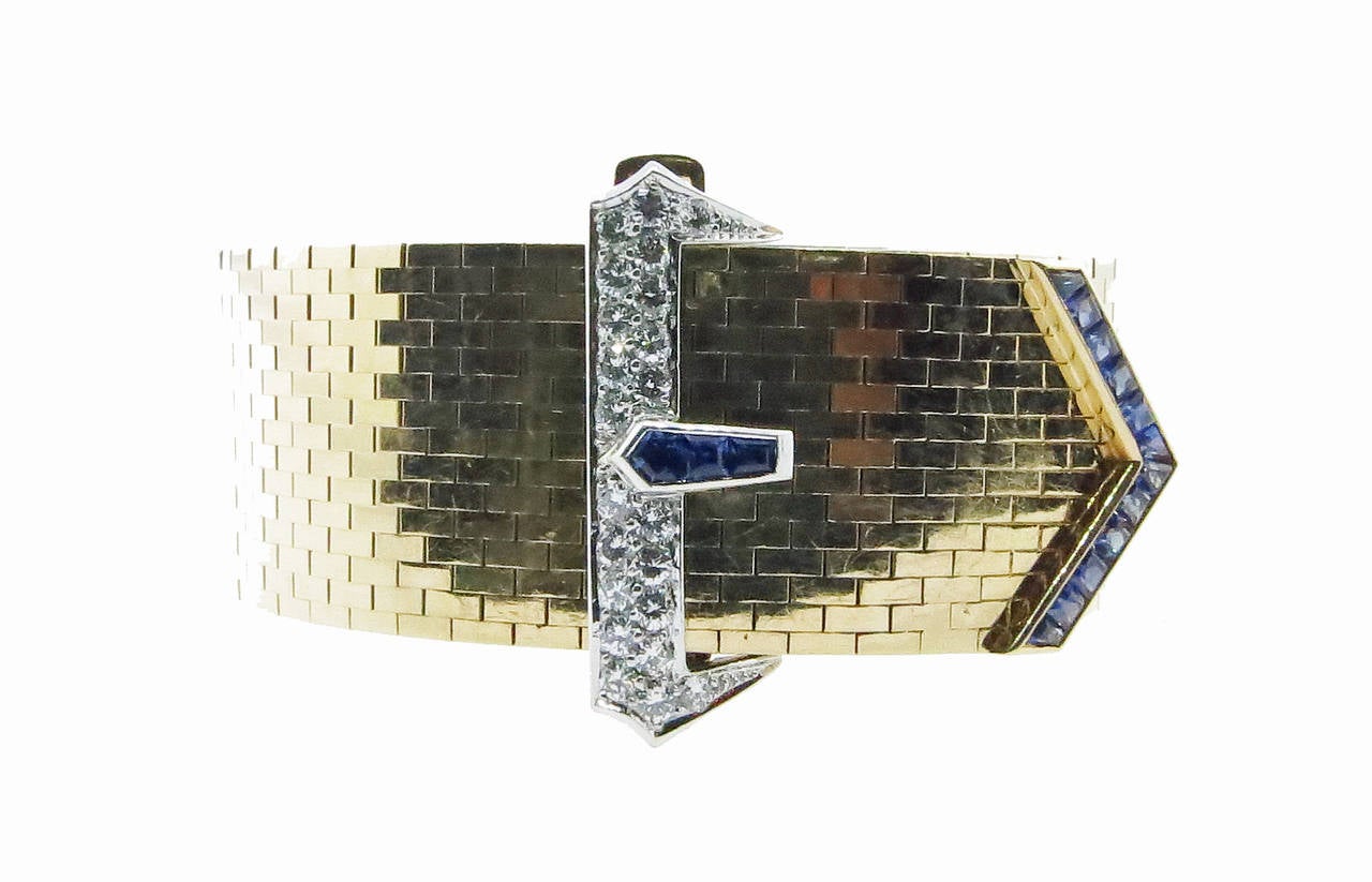 Silky linked and adjustable in size 14kt. yellow gold Retro buckle bracelet by Tiffany & Co. . The buckle is channel  set with fifteen faceted natural sapphires totaling approx 1.35cts  and bead set with twenty two round brilliant cut diamonds