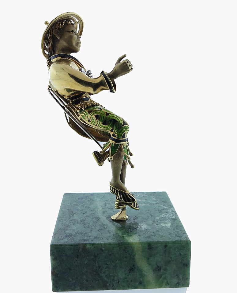 Beautifully made for display or for wear the detailed 18kt. yellow gold Asian figural brooch is  removable from the marble base. The dimensional figure measures  approximately 4 1/2 inches in length and is in green and black enamel. The body is set