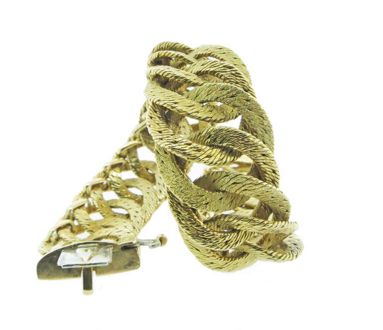 Extremely fluid Hermes 18kt. woven link bracelet with a hidden catch measuring 7 3/4