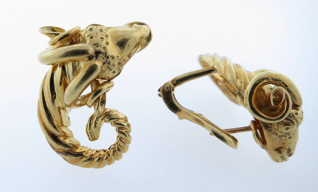 18kt. yellow gold opposing earrings in a ram head design. The earrings have clip and post back. Circa 1990.Signed Zolotas.