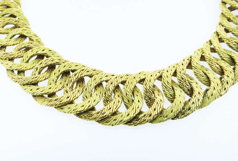 18kt. yellow gold woven link necklace by Hermes. The necklace measures 17