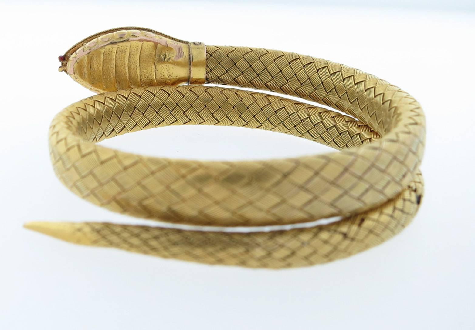 Wrap around woven 14kt. yellow gold snake braclelet that wraps around the wrist comfortably and will fit most wrists. The snakes head is enameled in four color enamel , the eyes are set with rose cut diamonds. Very fine condition given it's age