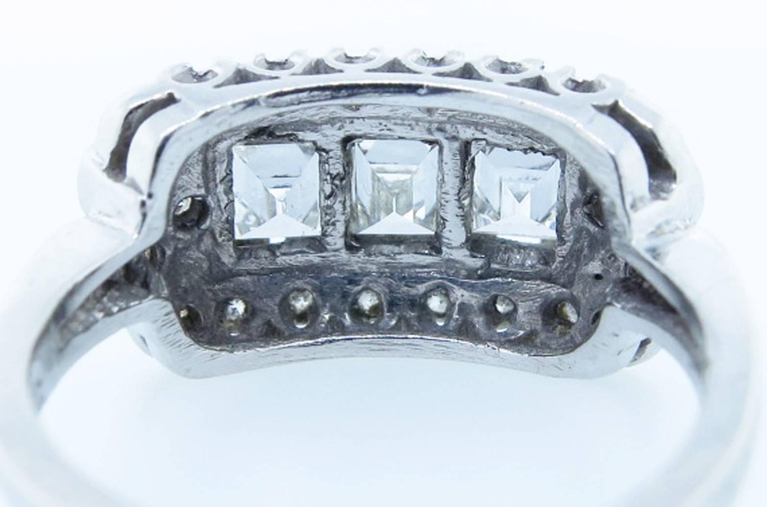 Exquisite Art Deco Three Stone Emerald Cut Diamond Platinum Ring In Excellent Condition For Sale In Lambertville, NJ