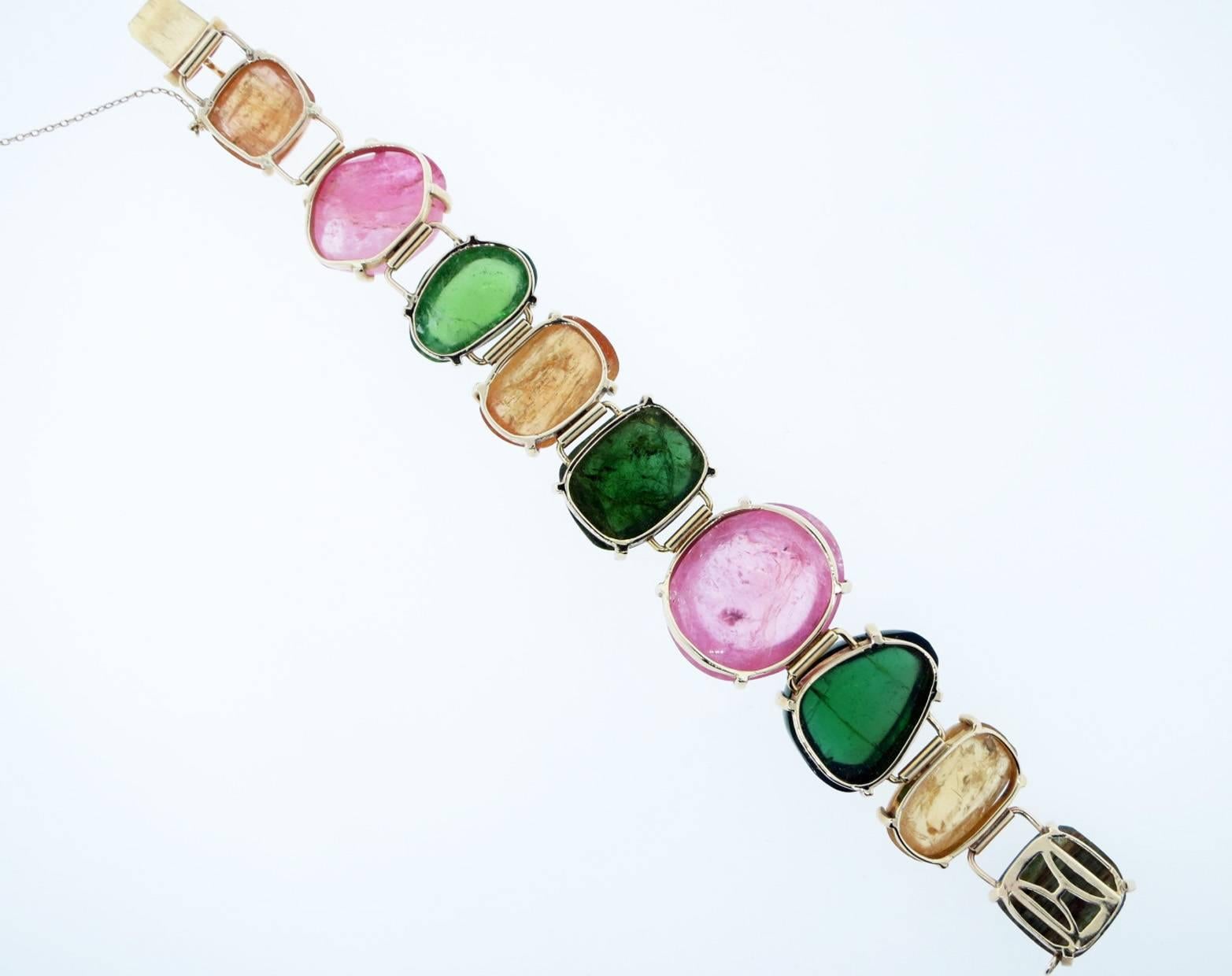 A chunky, fun and funky 14kt. yellow gold mixed tourmaline and citrine bracelet in tumbled forms made in the great state of Maine ! The bracelet measures approx 7 inches in length and 1 inch in width at the widest center stone. 