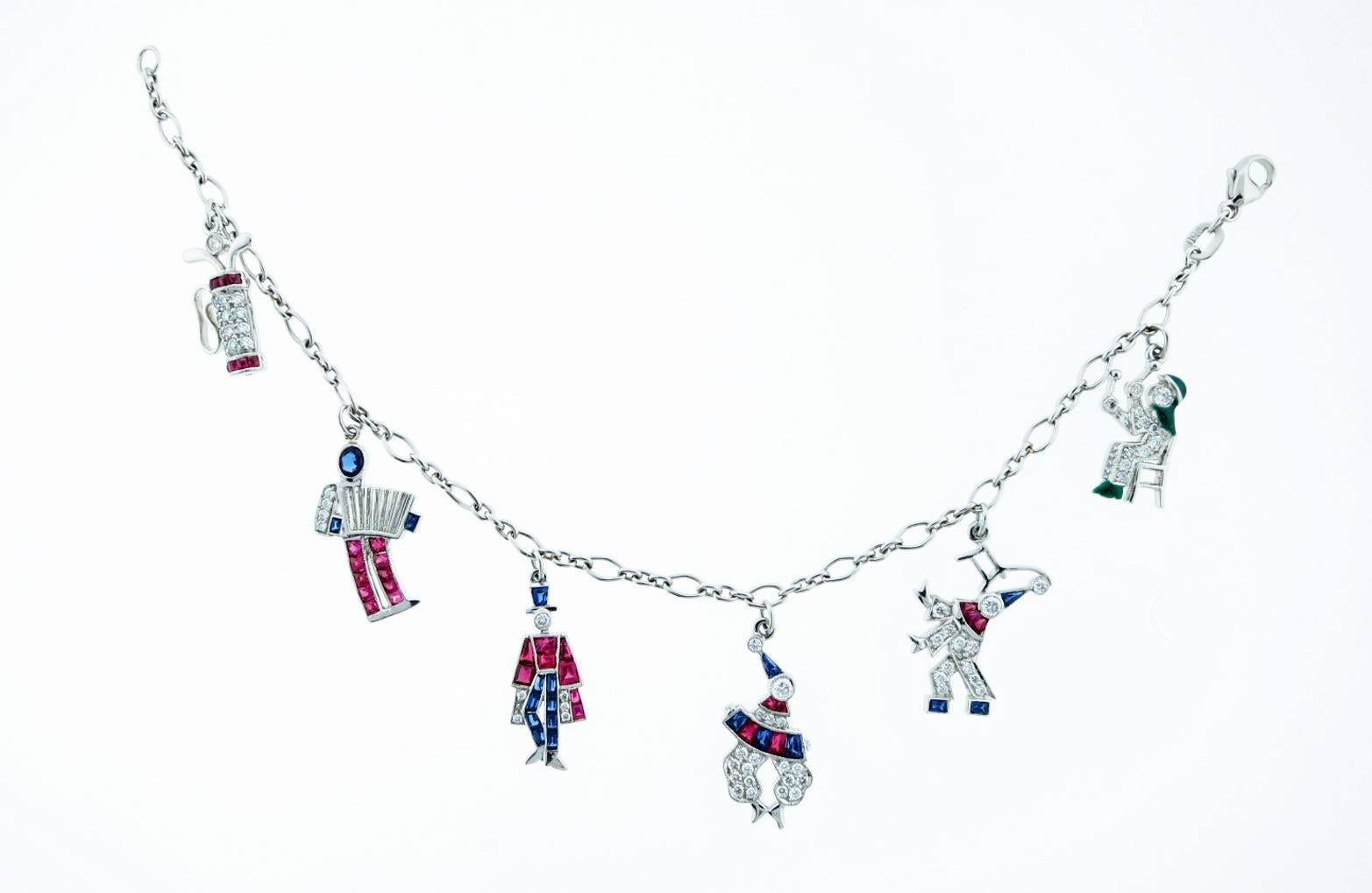 Platinum charm bracelet consisting of six handmade figures . The bracelet measures seven inches and each charm measures approx .75cts. and are bead and channel set with natural ruby, sapphire, diamond and green enamel. Perfect condition- cheerful