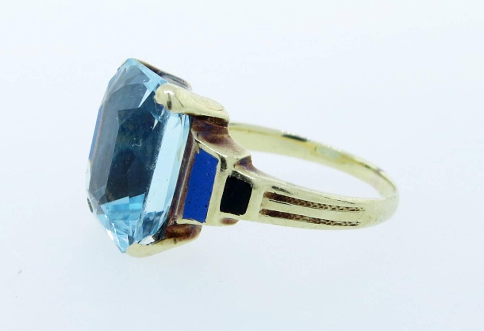 Period Art Deco 14kt. yellow gold ring prong set with faceted fine blue rectangular cushion natural aquamarine center. The ring is made by the Newark maker Allsopp & Long.  The aqua measures 12mm. x 10mm. and weighs approx 5.0cts . Each side of the