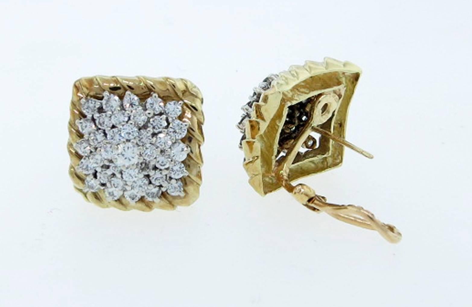 Pair of ladies clip and post back earrings. Each 14kt. rope edge earring measures a bit under 3/4 inches and is prong set in white gold with a pyramid of 38 round brilliant cut diamonds totaling approx 3.0cts. grading Vs clarity G-H color.