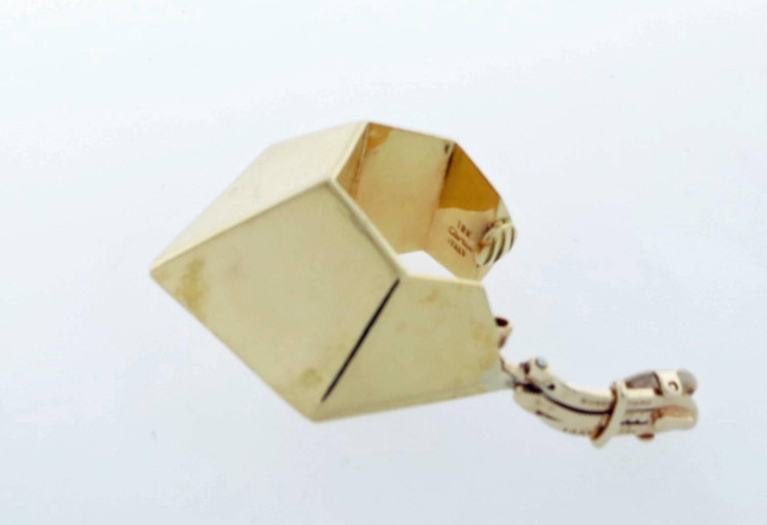 18kt. yellow gold Cubist design earrings made by Cartier Italy. Each earring measures approx 1 1/2 inches in length and has 14kt. yellow gold clip backs. The earrings are circa 1960.