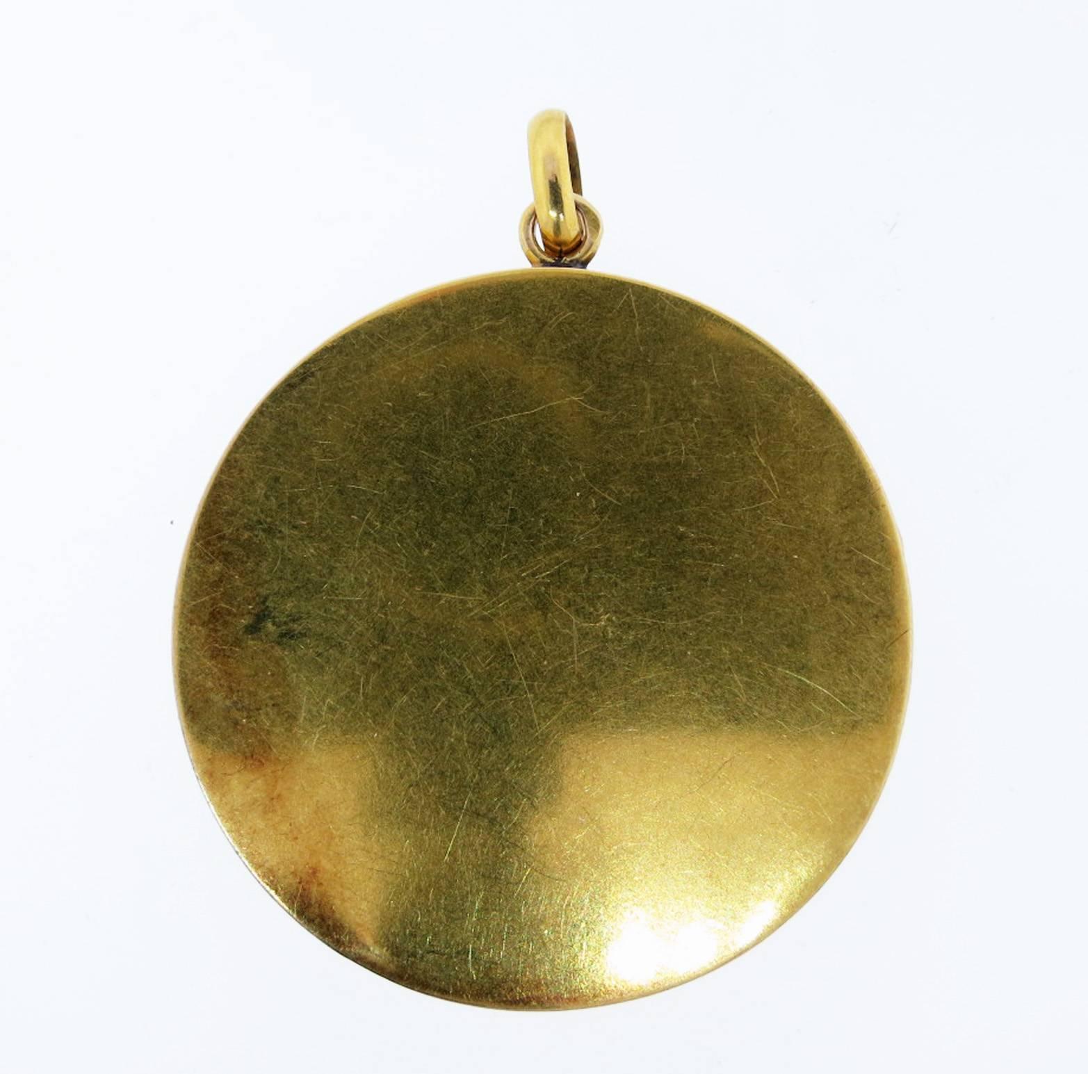 Wonderful and historic French 18kt. yellow gold locket commemorating the much celebrated arrival in Paris of the Wright brothers in 1908. The locket measures approx 1 1/2 inches and is in remarkable condition with diamond accents,  French hallmarks