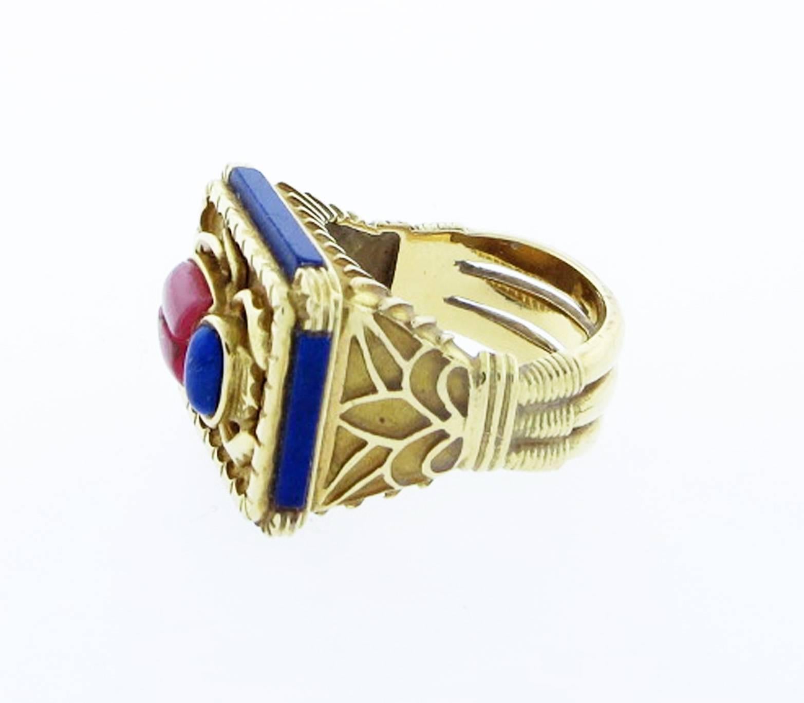 Substantial Egyptian inspired 18kt. yellow gold ring with an inlay scarab motif center of natural rhodochrosite and lapis. The edges of the richly detailed mount ring are set with inlays of lapis. Size 8 and can be sized. Ideal for a man or a woman !