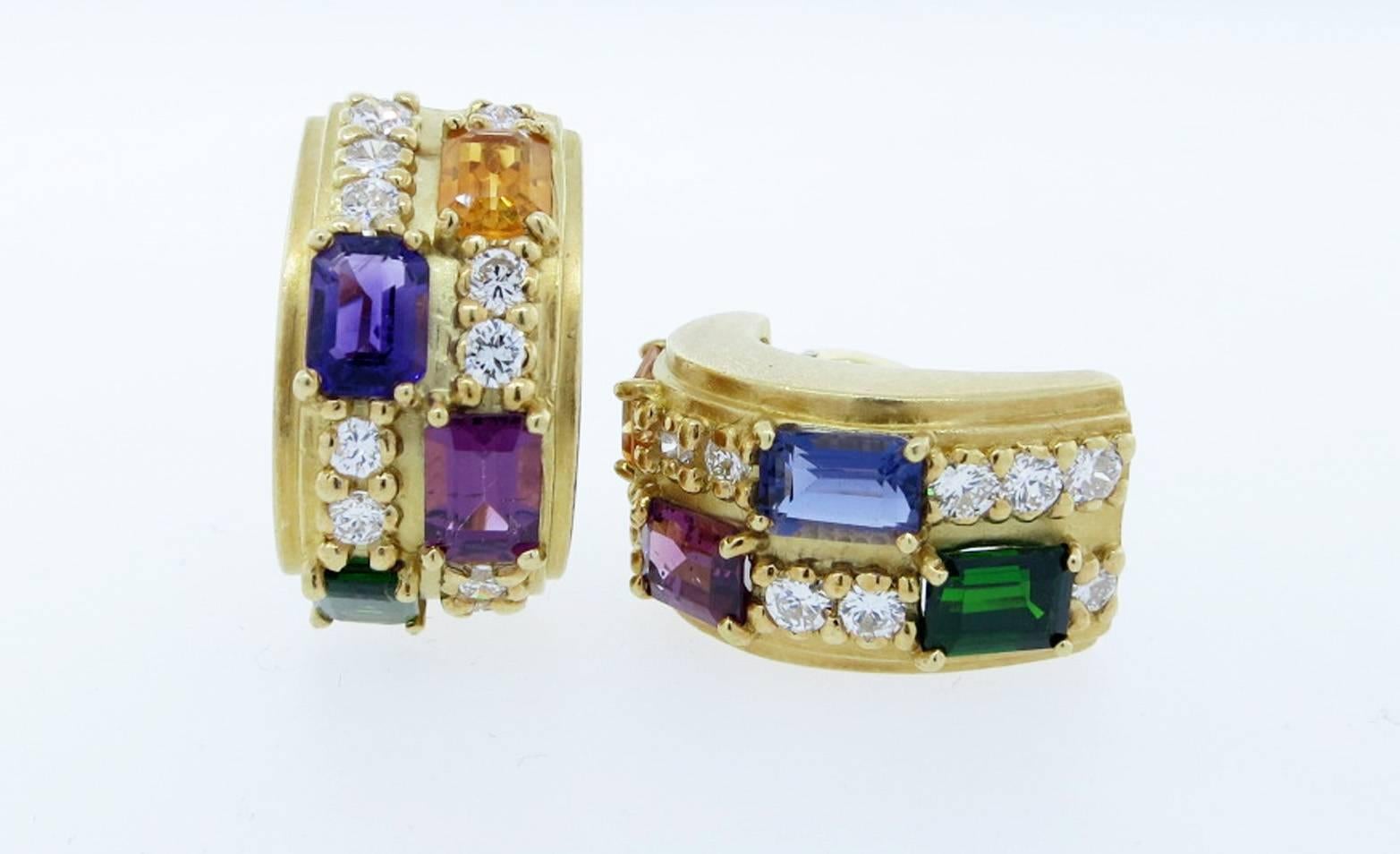 Handsome 18kt. yellow gold clip and post back earrings. Each half  hoop earring measures 1 inch in length and is set with an emerald cut citrine, iolite, pink tourmaline and green tourmaline measuring 7. mm. x 5.mm. Each are also prong set with