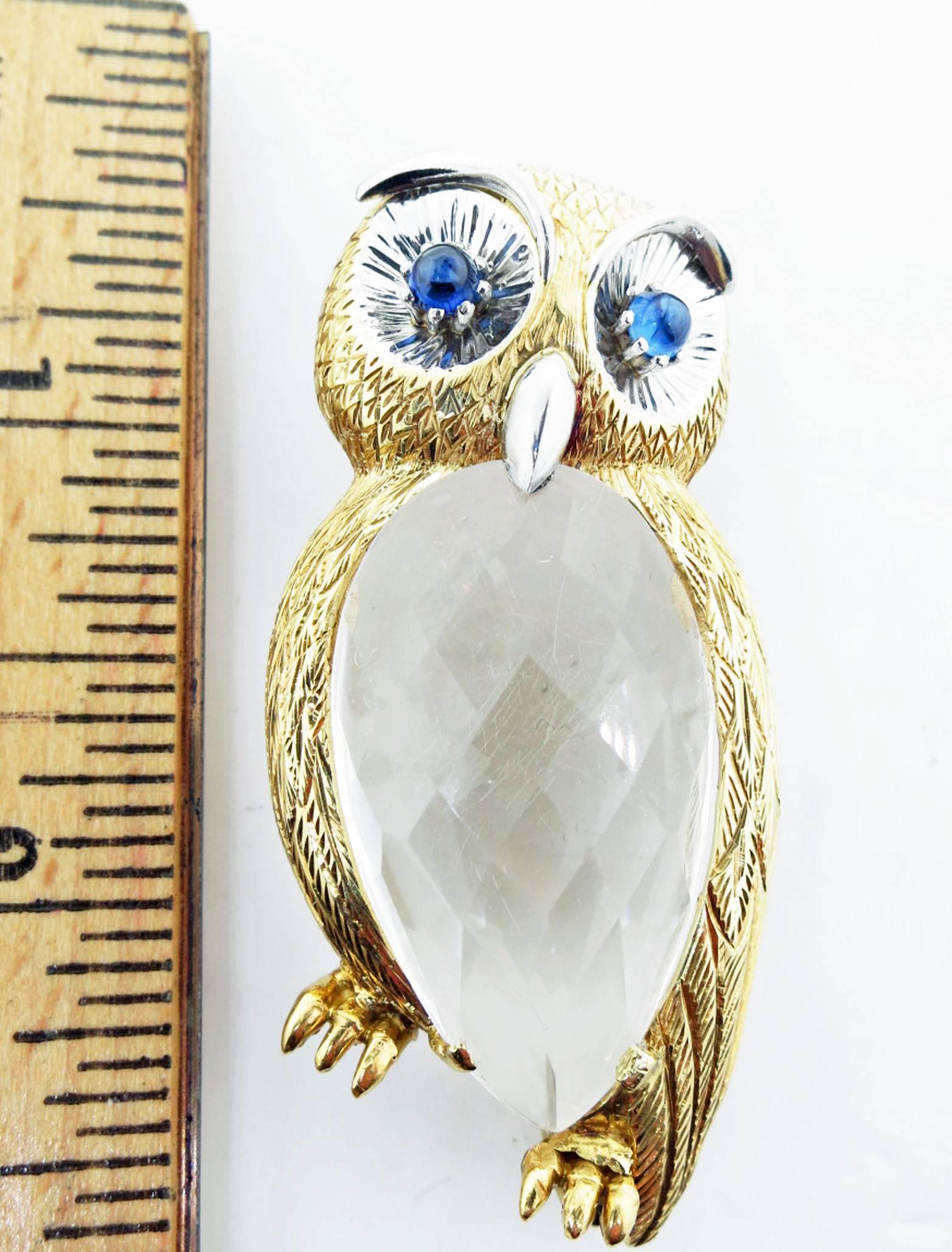 Finely detailed and dimensional 18kt. yellow and white gold owl brooch. The brooch measures approx 2 1/4 inches in length and the body is set with a faceted oval of rock crystal. Cabochon sapphire eyes and endearing expression.
Perfect for any
