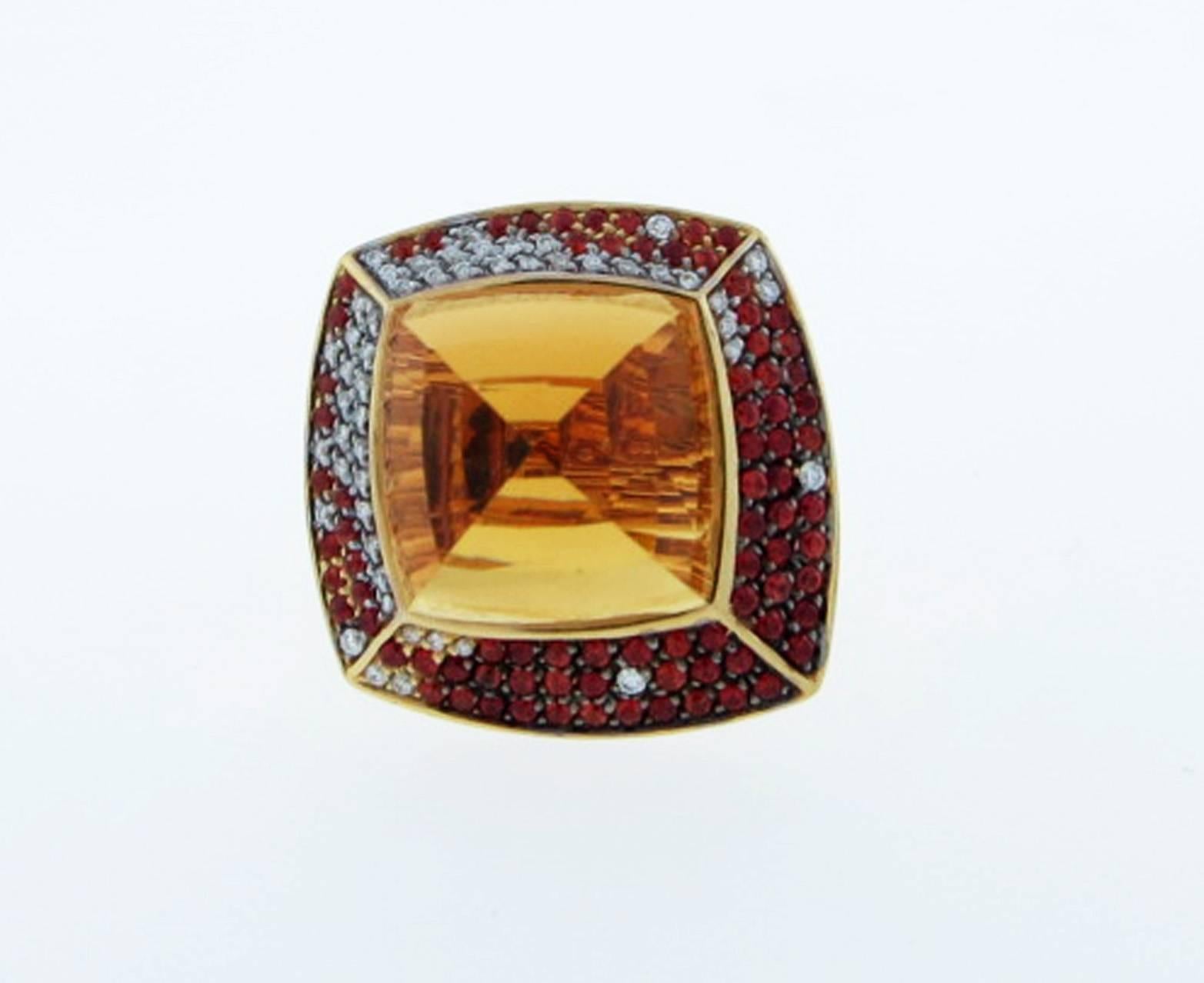 Original and innovative design 18kt. yellow gold ring by the Italian jeweler Valente. The center is set with a pyramid shape faceted citrine weighing approx 
 16.0cts. The surrounding asymmetrical mount is bead set with a mix of round brilliant cut