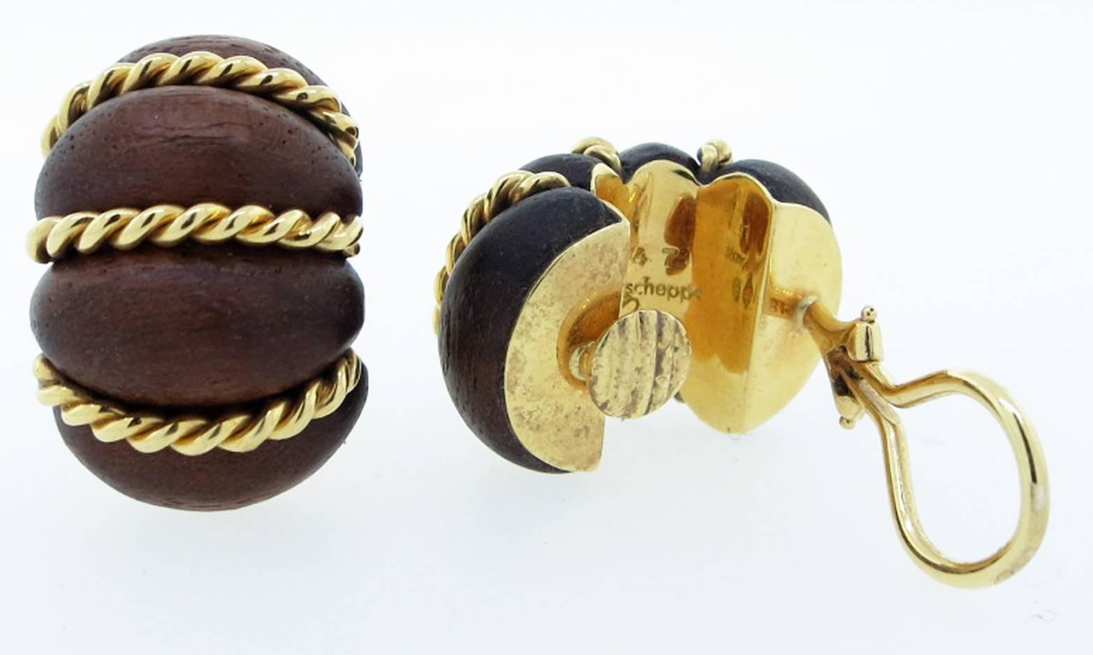 Iconic Seaman Schepps carved fruitwood and 18kt. yellow gold earrings. Each earring measures approx. 1 inch in length and be worn with ease from daytime to evening wear. Clip back posts can be added.