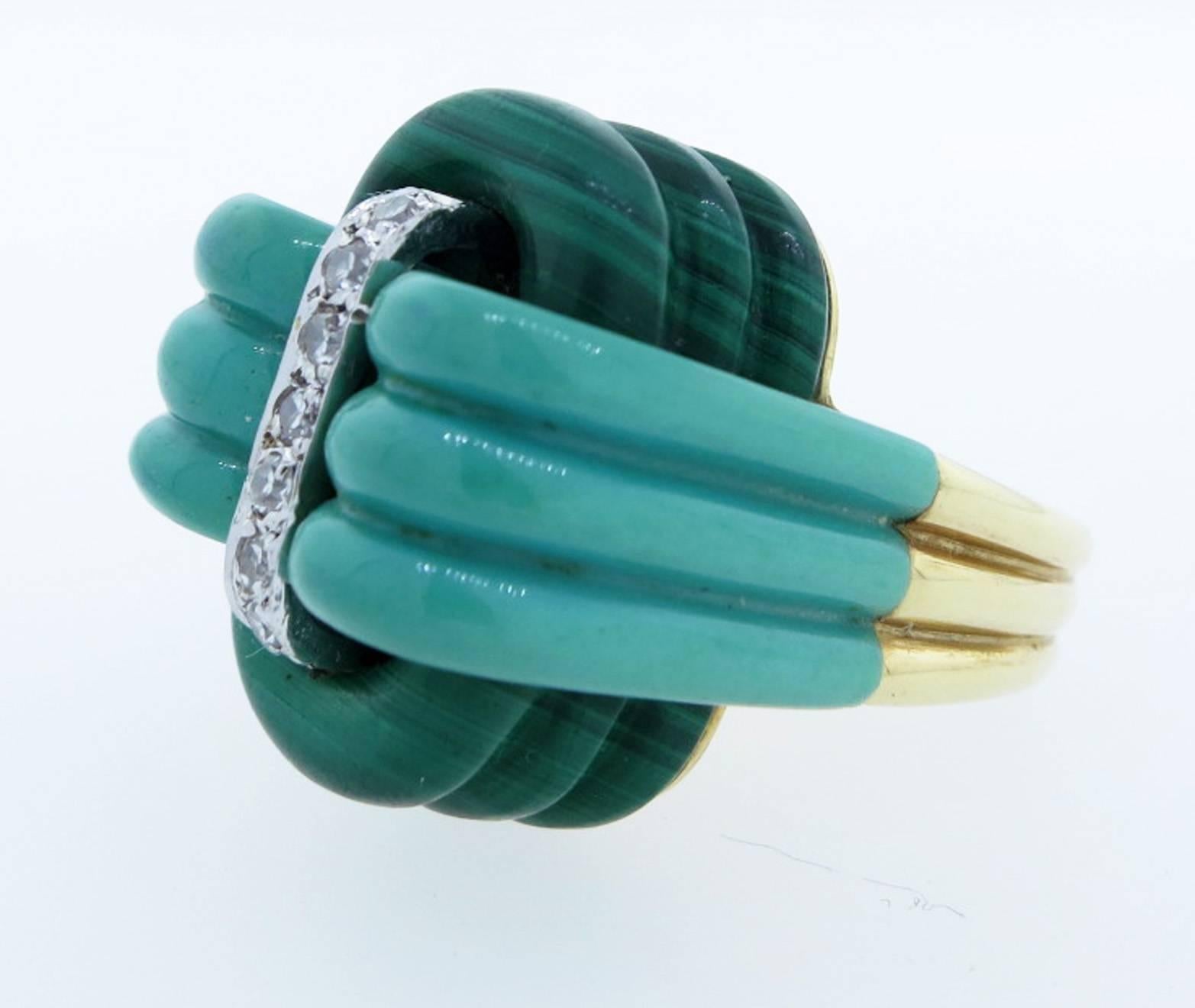 Sensational 14kt. yellow gold stacked carved Malachite and Amazonite ring circa 1970. The center is bead set in white gold with seven round accent diamonds.
The ring is size 6 1/2 and can be sized. Excellent condition !