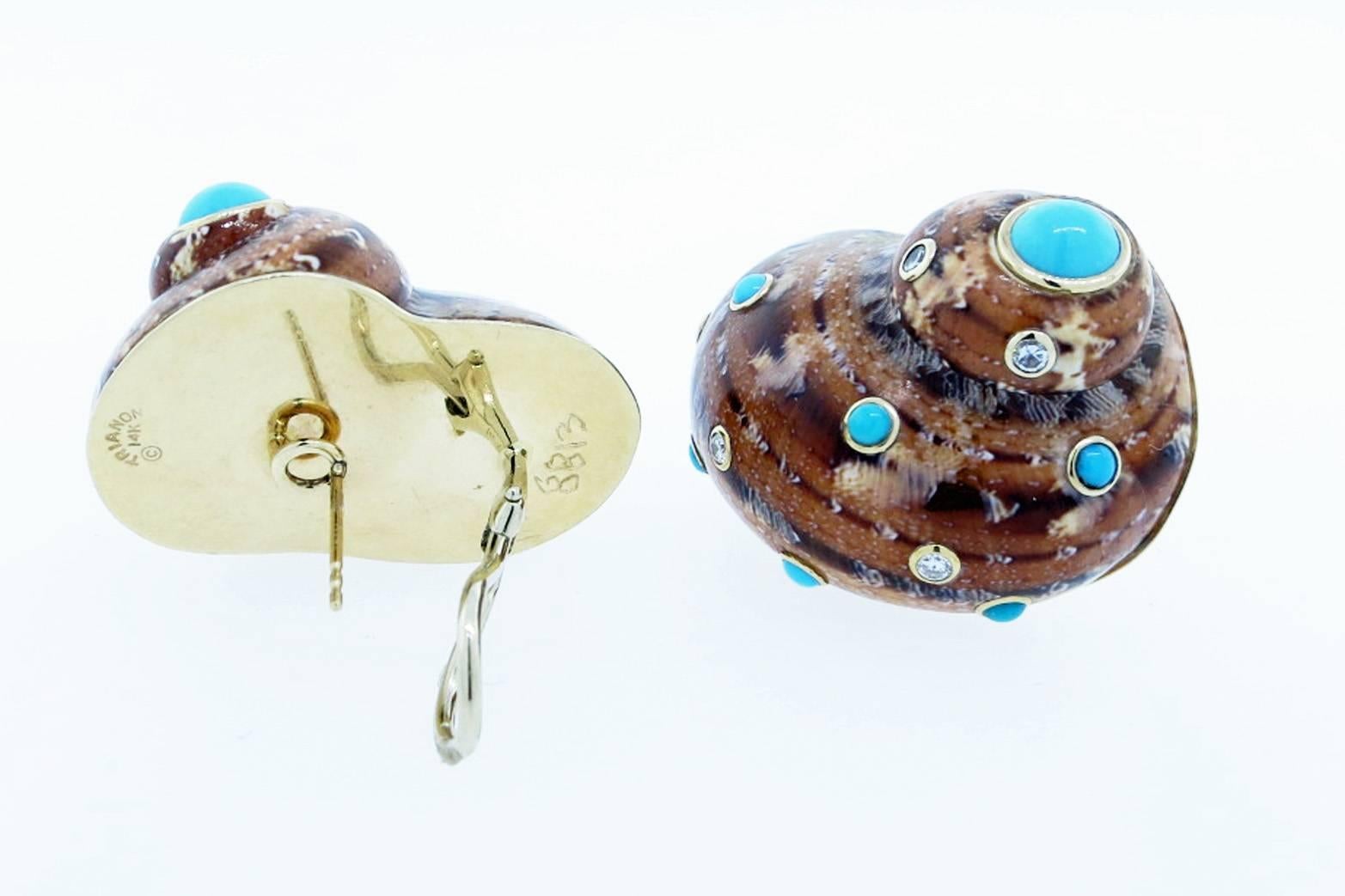 14kt. yellow gold mounted opposing natural shell earrings measuring approx 1.25 inches in length. Each clip and post back earring is bezel set with seven turquoise  cabochons and five round brilliant cut diamonds. Signed Trianon.