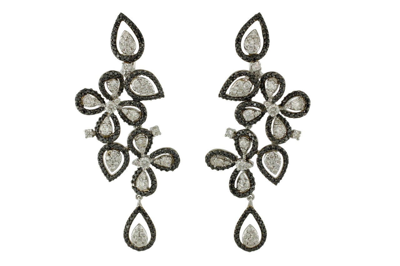 These truly smashing Burdeen's Cluster Drop Long Leaf Tendril Earrings are 18K White Gold with white & black diamonds ( 98 white diamonds = 2.95ctw & 393 black diamonds = 2.61ctw ). These earrings are the perfect addition to any stunning dress or